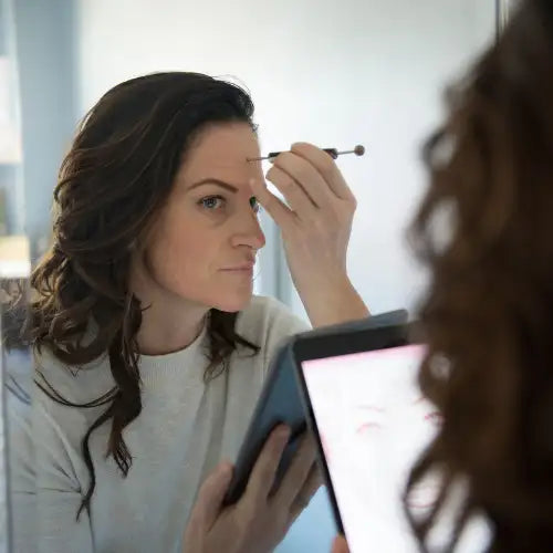 Silver eyebrow pencil with black tip